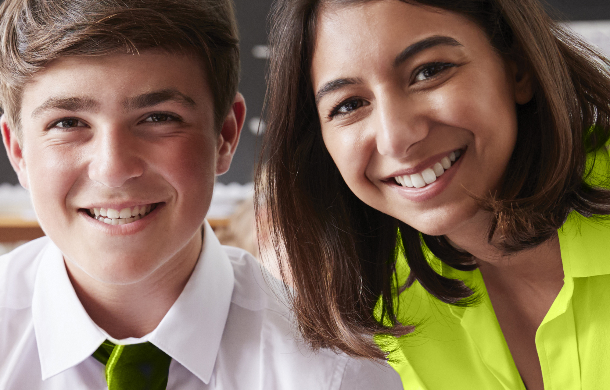 Workers compensation coverage for schools - Image of teacher with student